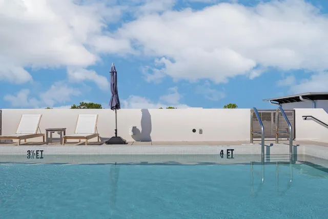 a view of a kitchen with dining table and chairs