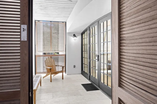 a bathroom with a bathtub sink vanity and mirror