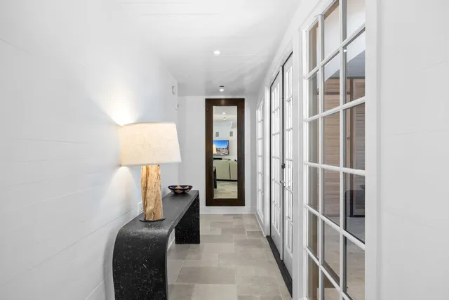 a kitchen with stainless steel appliances a sink a stove a refrigerator and cabinets