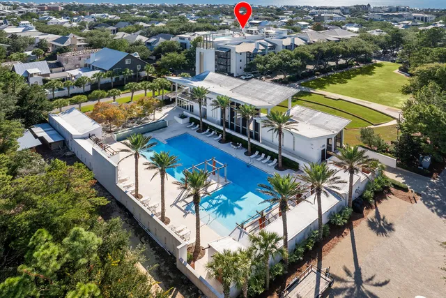 an aerial view of a house with a swimming pool
