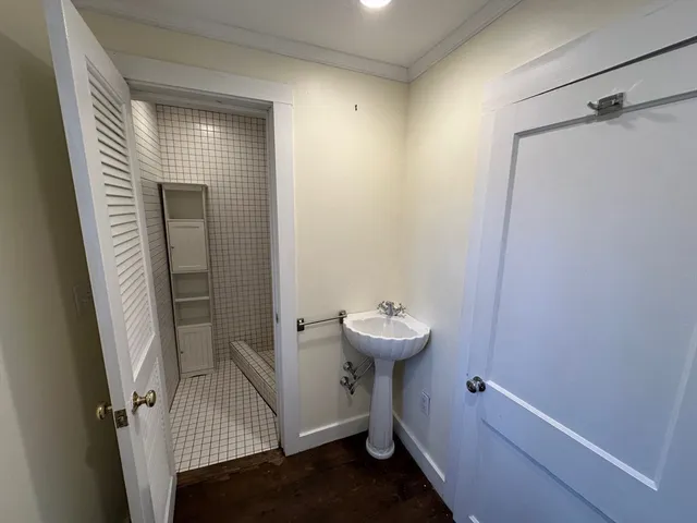 a view of a bathroom from a hallway