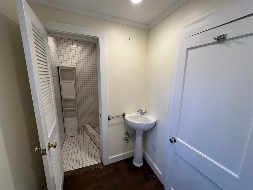 333 Dedham Street Dover, MA 02030 - Photo 21 of 24 a view of a bathroom from a hallway