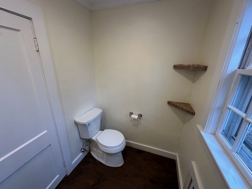 333 Dedham Street Dover, MA 02030 - Photo 22 of 24 a white toilet sitting next to a shower