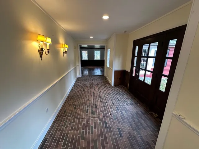 a view of a hallway view with staircase