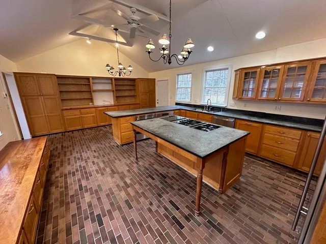 a living room with a table chairs and wooden floor