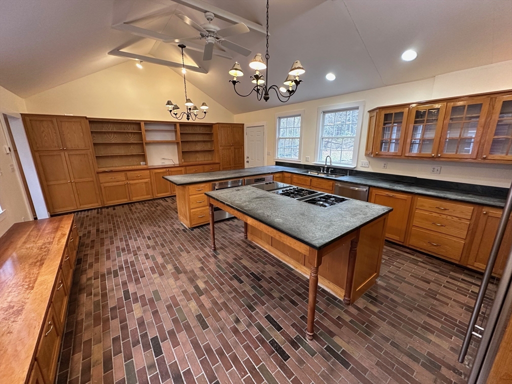 333 Dedham Street Dover, MA 02030 - Photo 5 of 24 a living room with a table chairs and wooden floor