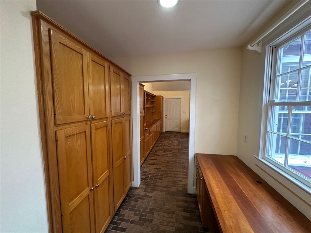 333 Dedham Street Dover, MA 02030 - Photo 7 of 24 a view of a hallway with wooden floor and staircase