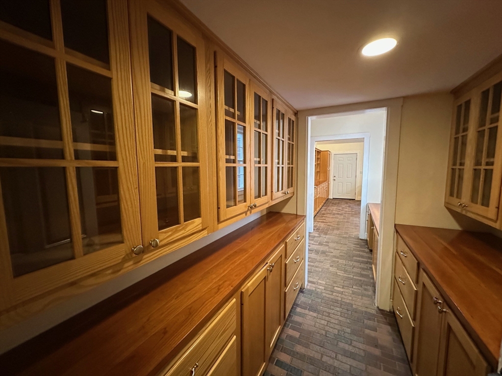 333 Dedham Street Dover, MA 02030 - Photo 9 of 24 a view of a hallway with wooden floor and staircase
