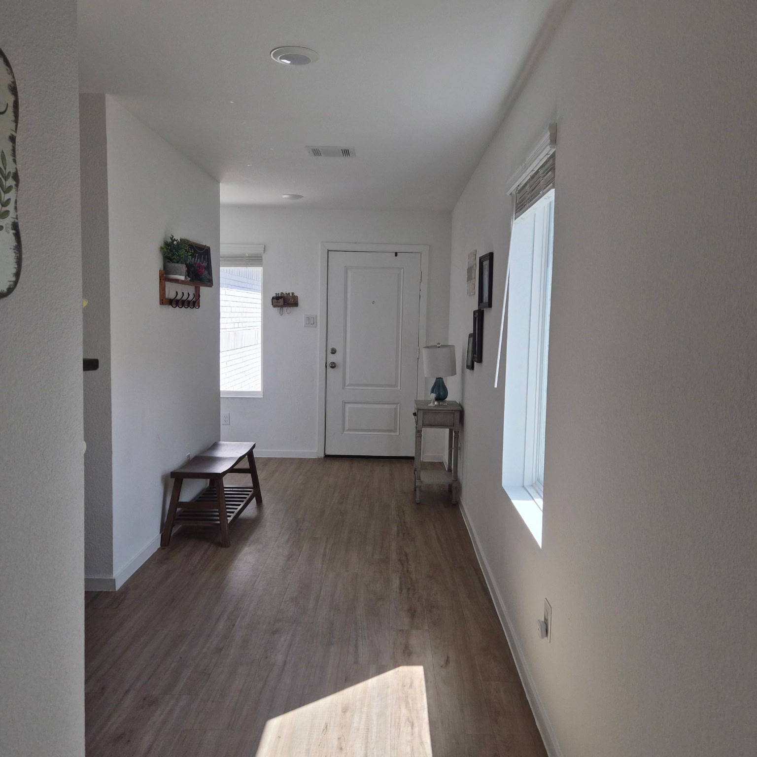 1723 Windrose Bend Angleton, TX 77515 - Photo 11 of 16 a view of a livingroom with wooden floor and a window