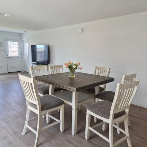 a view of a dining room with furniture