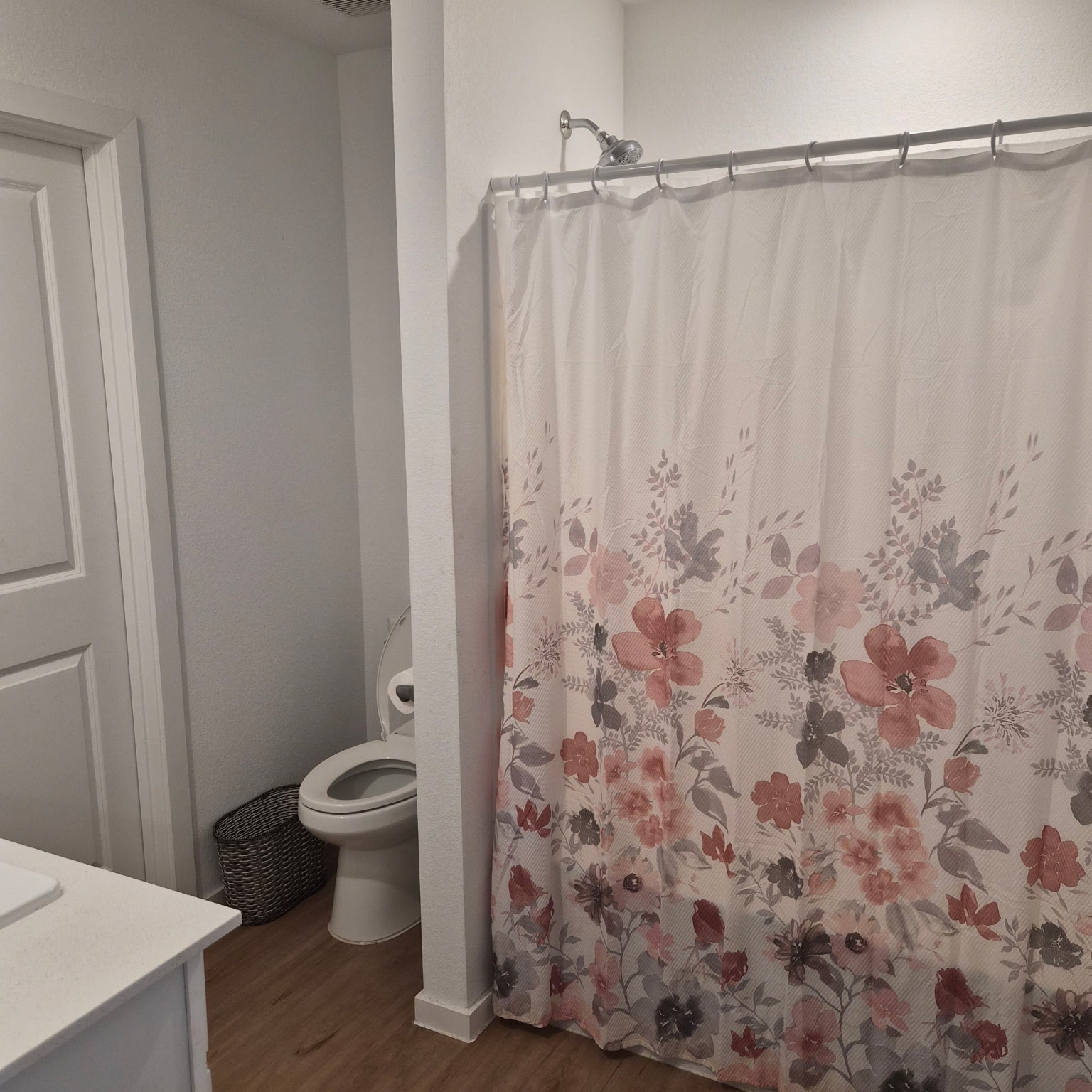 1723 Windrose Bend Angleton, TX 77515 - Photo 6 of 16 a bathroom with a toilet and a shower curtain