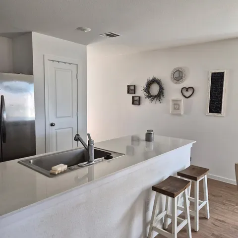 a kitchen with a table and chairs in it