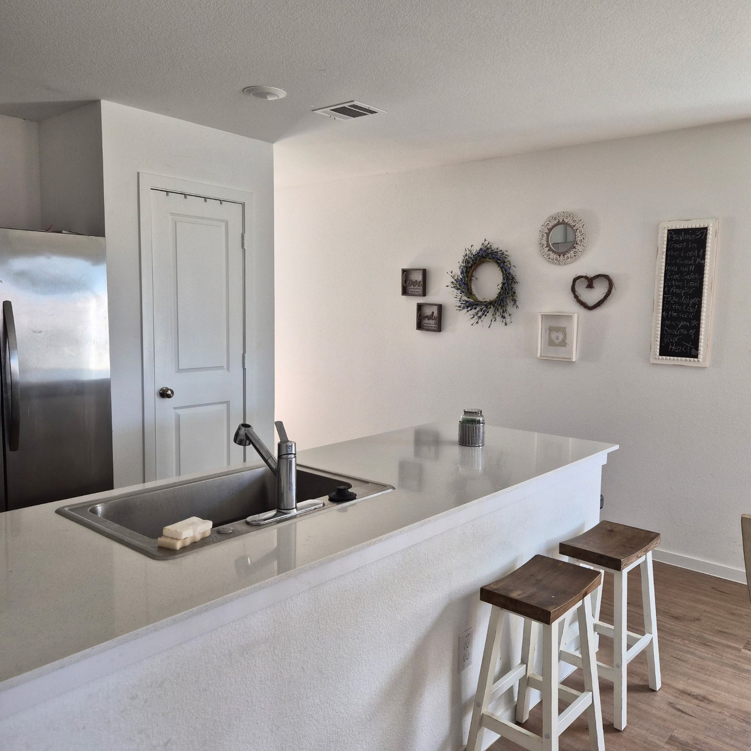 1723 Windrose Bend Angleton, TX 77515 - Photo 9 of 16 a kitchen with a table and chairs in it
