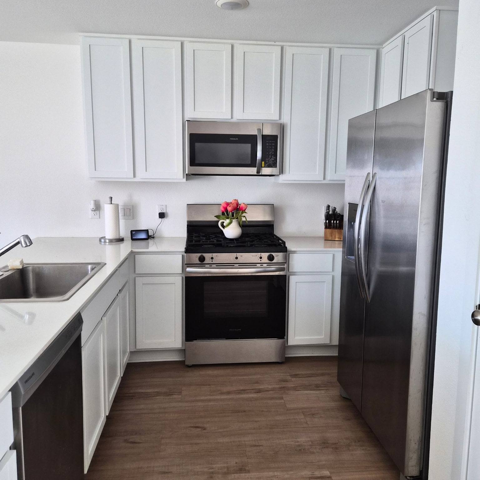 1723 Windrose Bend Angleton, TX 77515 - Photo 10 of 16 a kitchen with a sink stove and refrigerator
