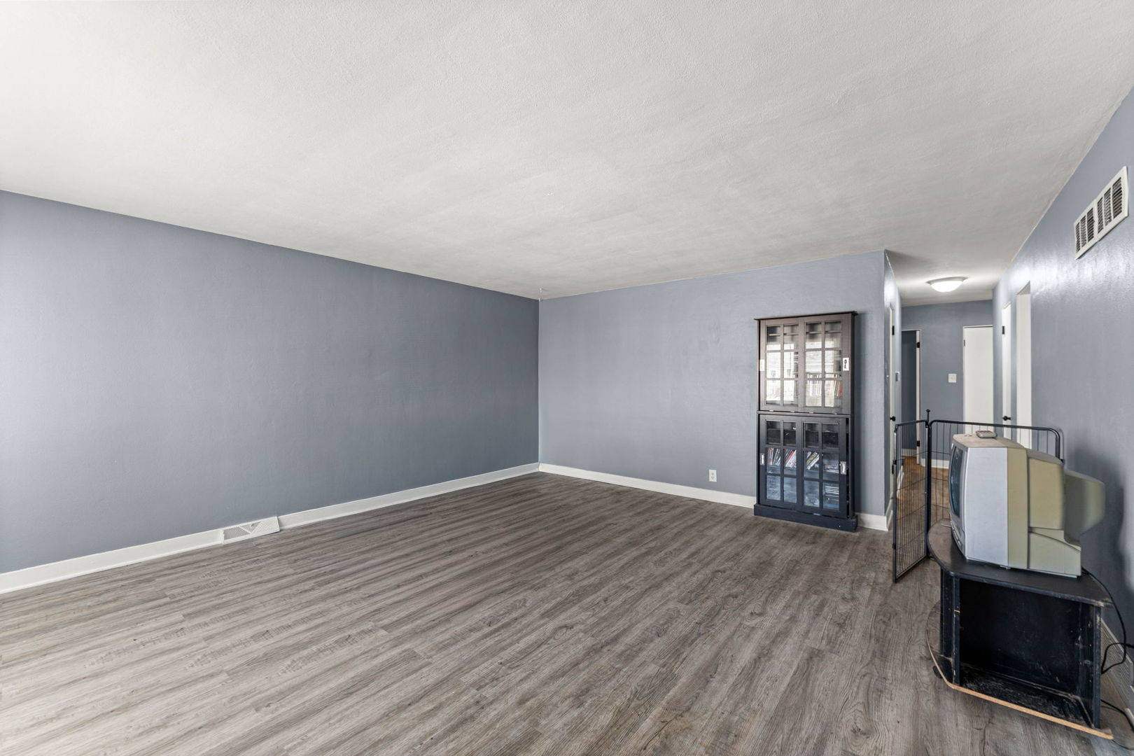17831 Community Street Lansing, IL 60438 - Photo 6 of 22 wooden floor in an empty room with a window