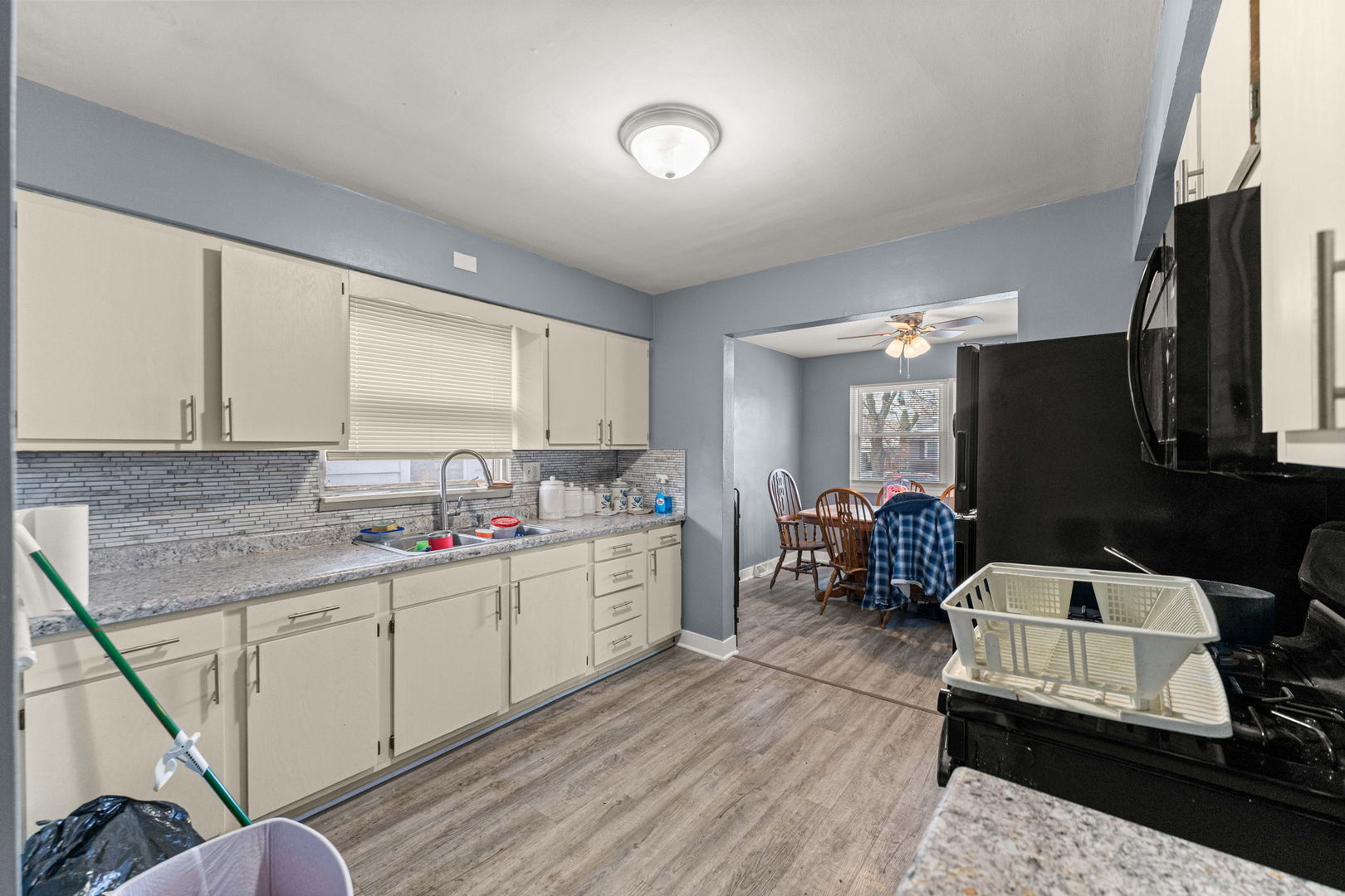 17831 Community Street Lansing, IL 60438 - Photo 8 of 22 a kitchen with a sink and cabinets