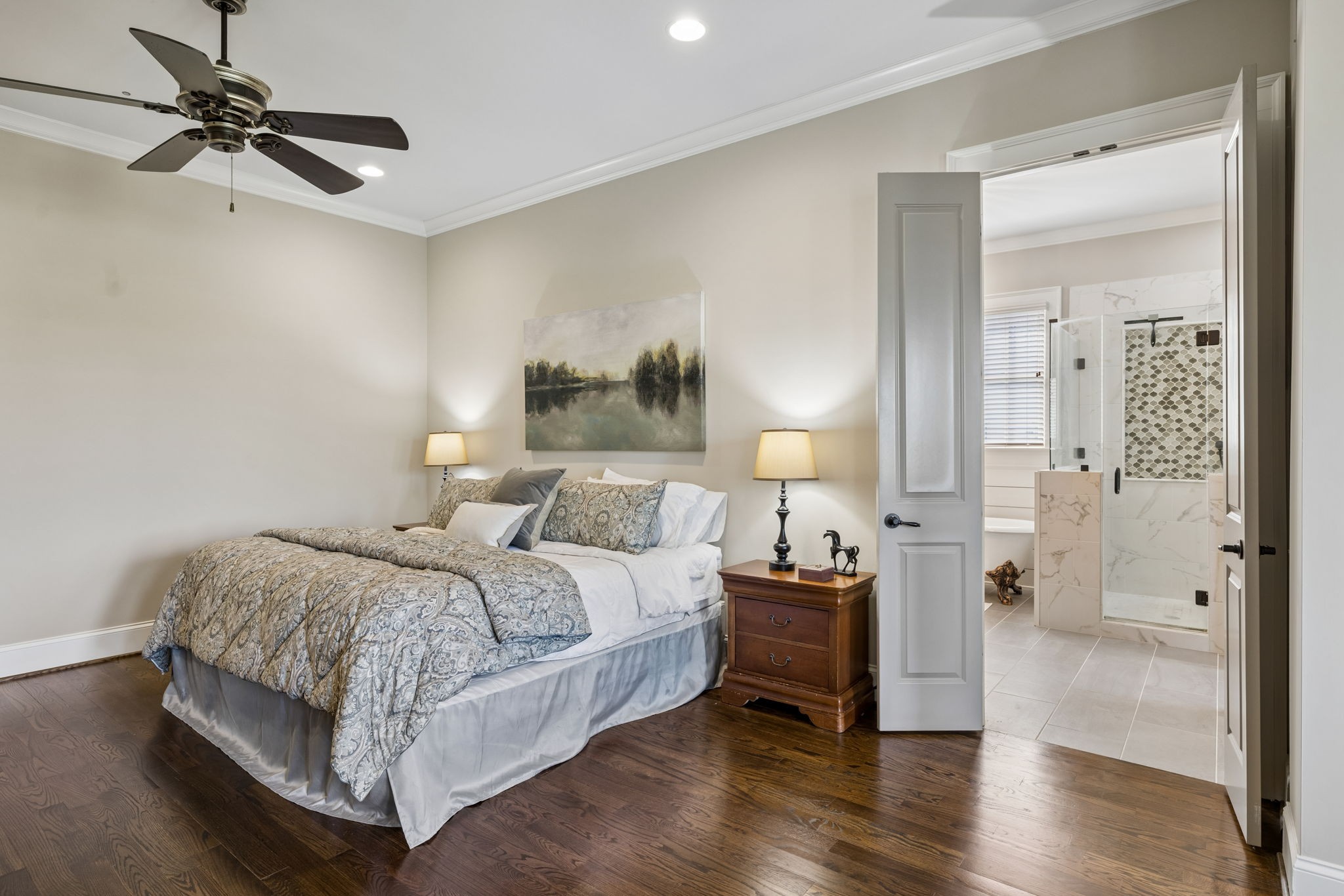 6033 Native Pony Trail College Grove, TN 37046 - Photo 45 of 87 a bedroom with a bed and a chandelier