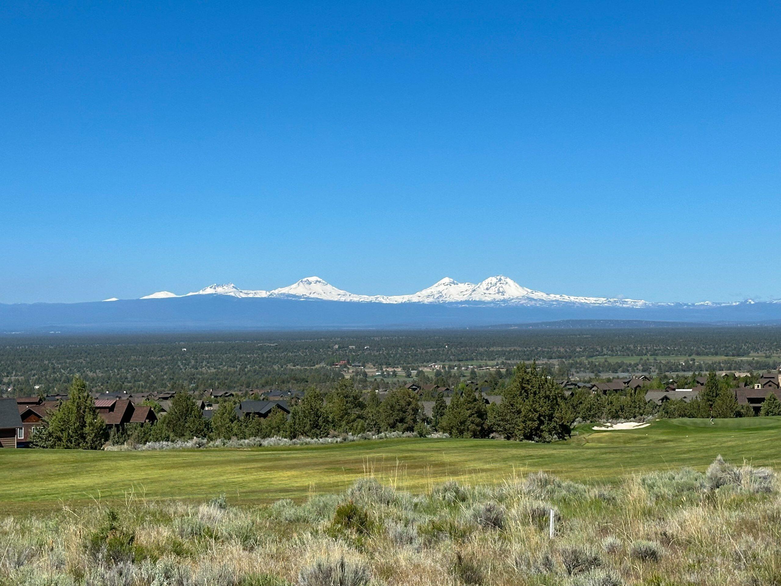 16181 South W Brasada Ranch Road, Unit 115 Powell Butte, OR 97753 - Photo 2 of 25 a view of a green field with an ocean view