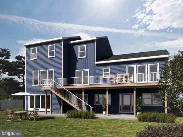 a kitchen with stainless steel appliances kitchen island granite countertop a table and chairs in it