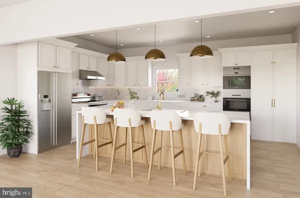 a living room with furniture a potted plant and a chandelier