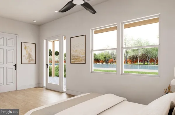 a spacious bedroom with a bed and a window