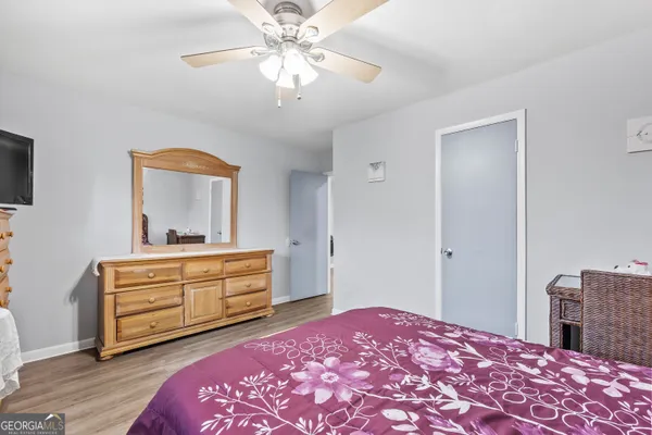a bedroom with a bed and a dresser