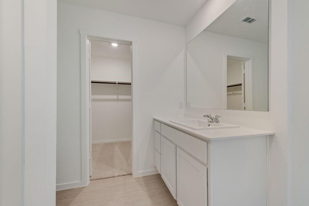 245 Boxberry Way Princeton, TX 75407 - Photo 20 of 23 a bathroom with a sink a toilet and mirror