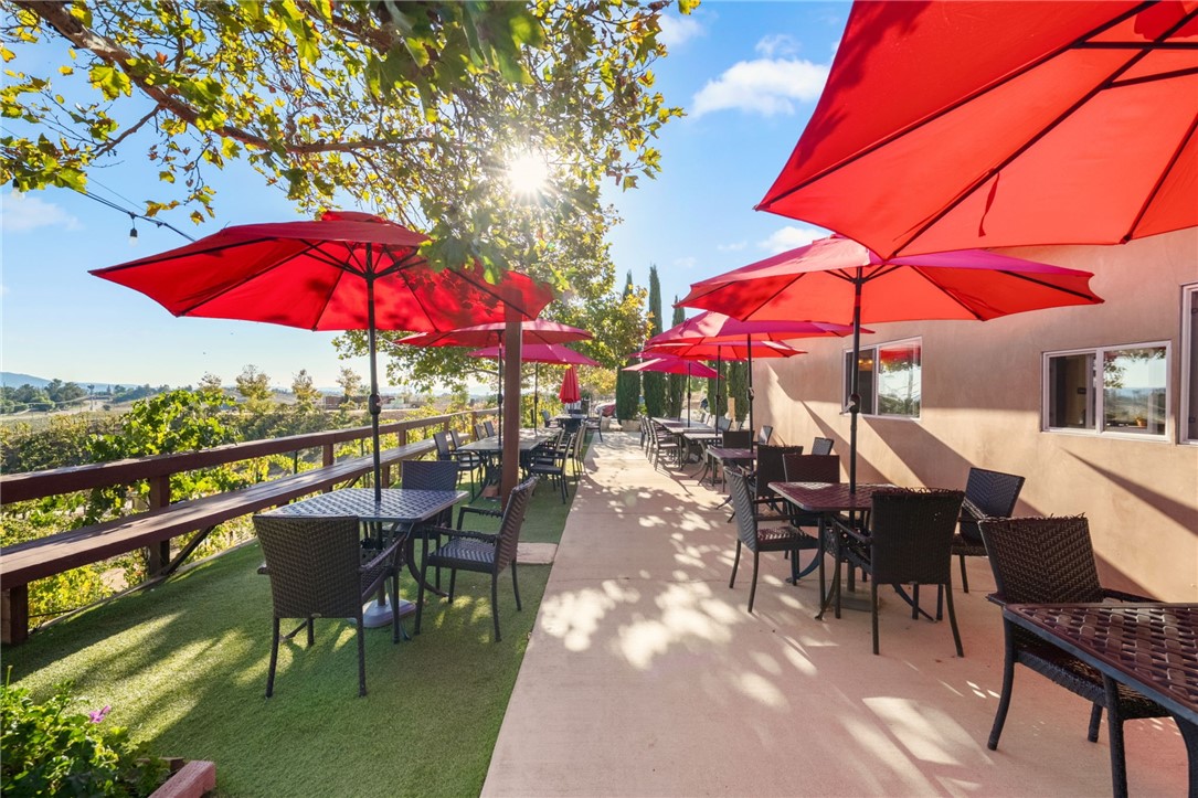 39750 De Portola Road Temecula, CA 92592 - Photo 54 of 60 a view of a patio with a table and chairs under an umbrella