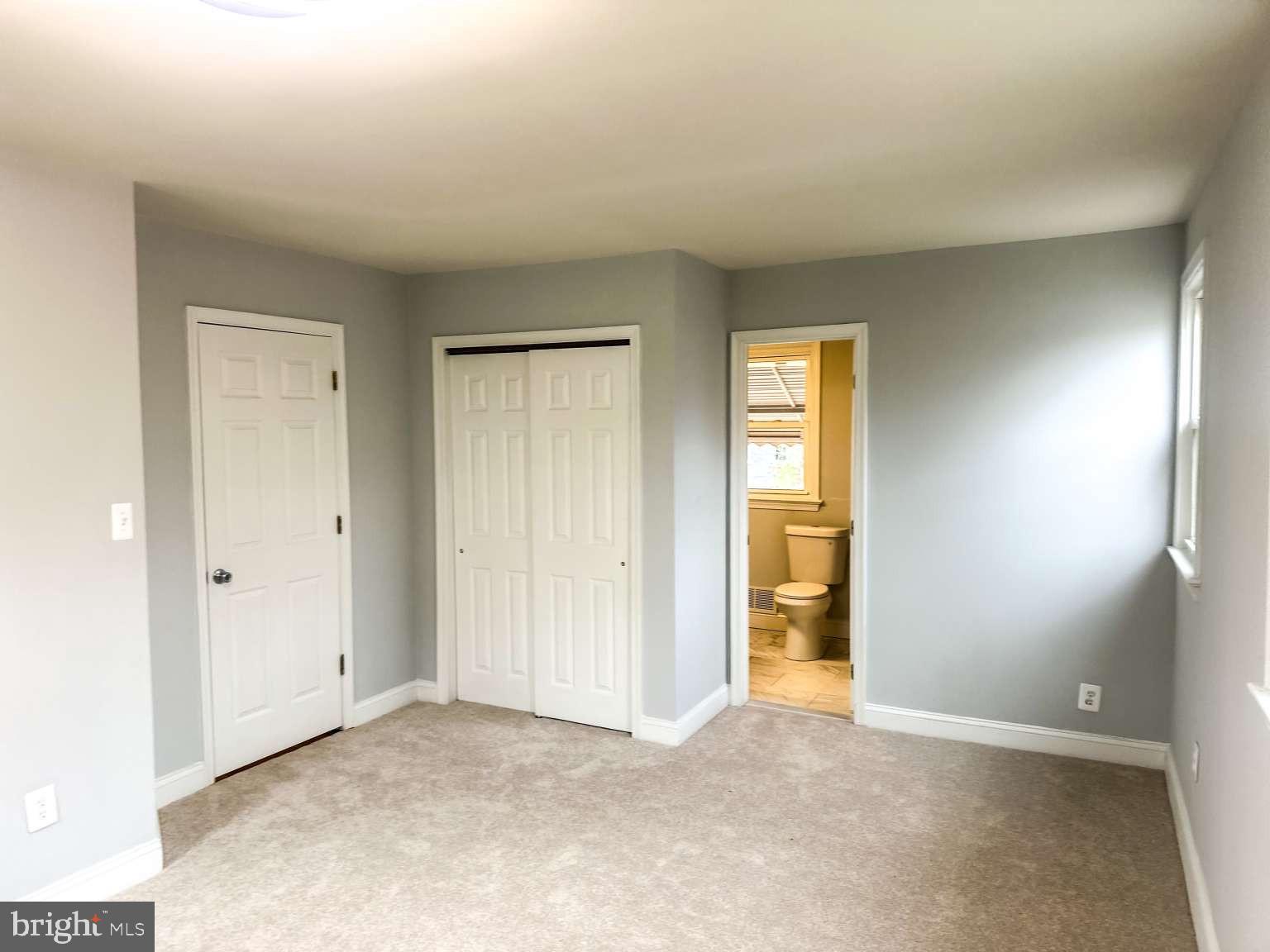 7107 Loch Raven Road Temple Hills, MD 20748 - Photo 12 of 36 a view of an empty room with window and bathroom