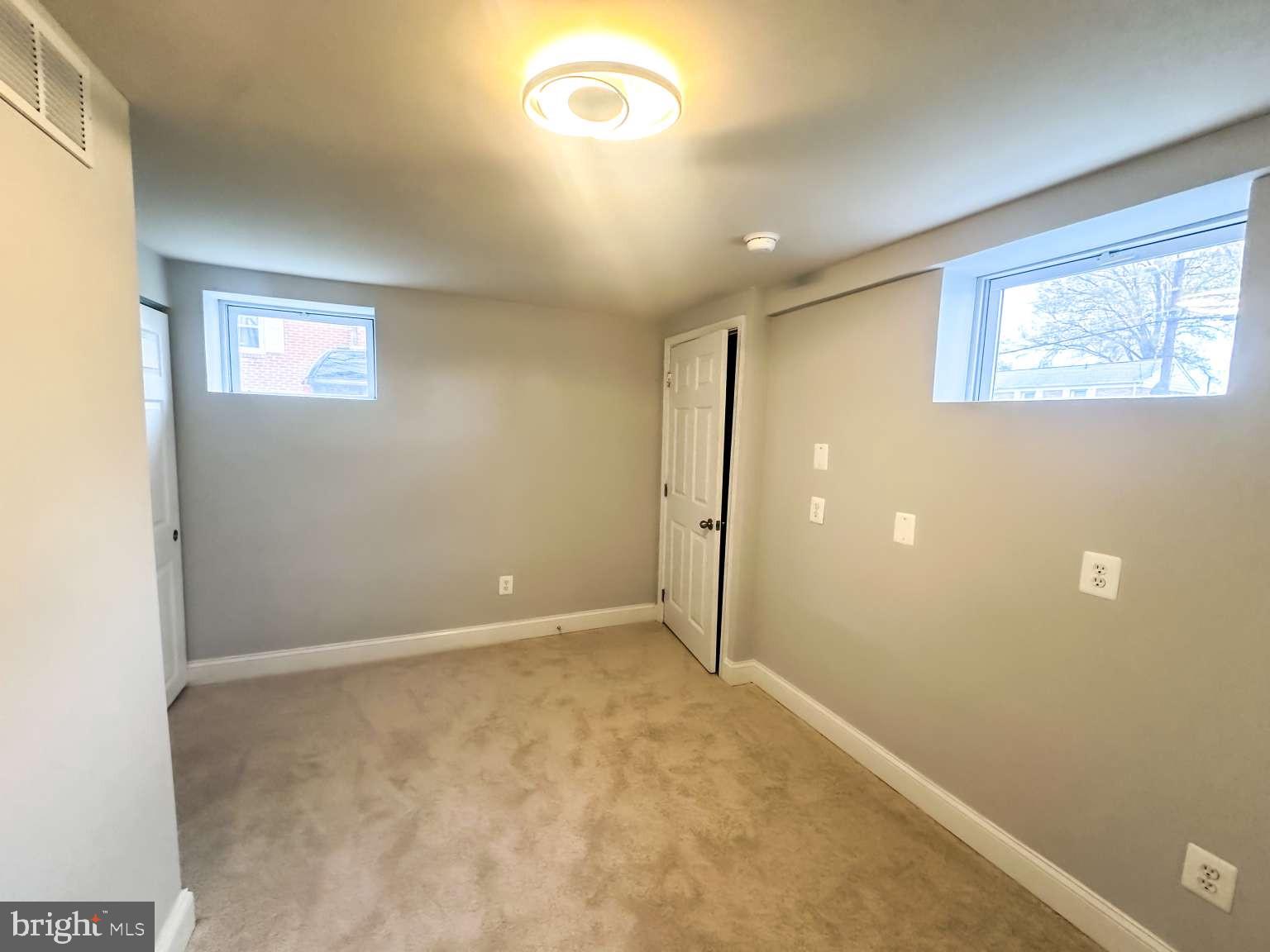 7107 Loch Raven Road Temple Hills, MD 20748 - Photo 19 of 36 an empty room with windows