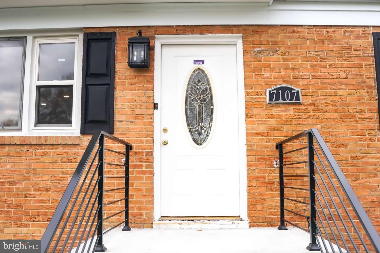 7107 Loch Raven Road Temple Hills, MD 20748 - Photo 2 of 36 a view of wooden door