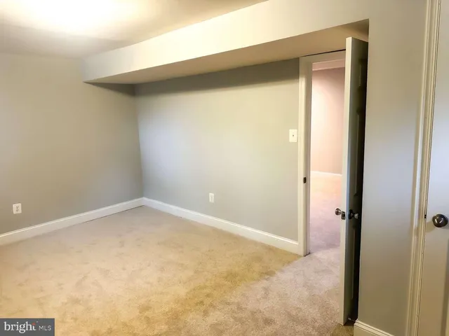 an empty room with a bench