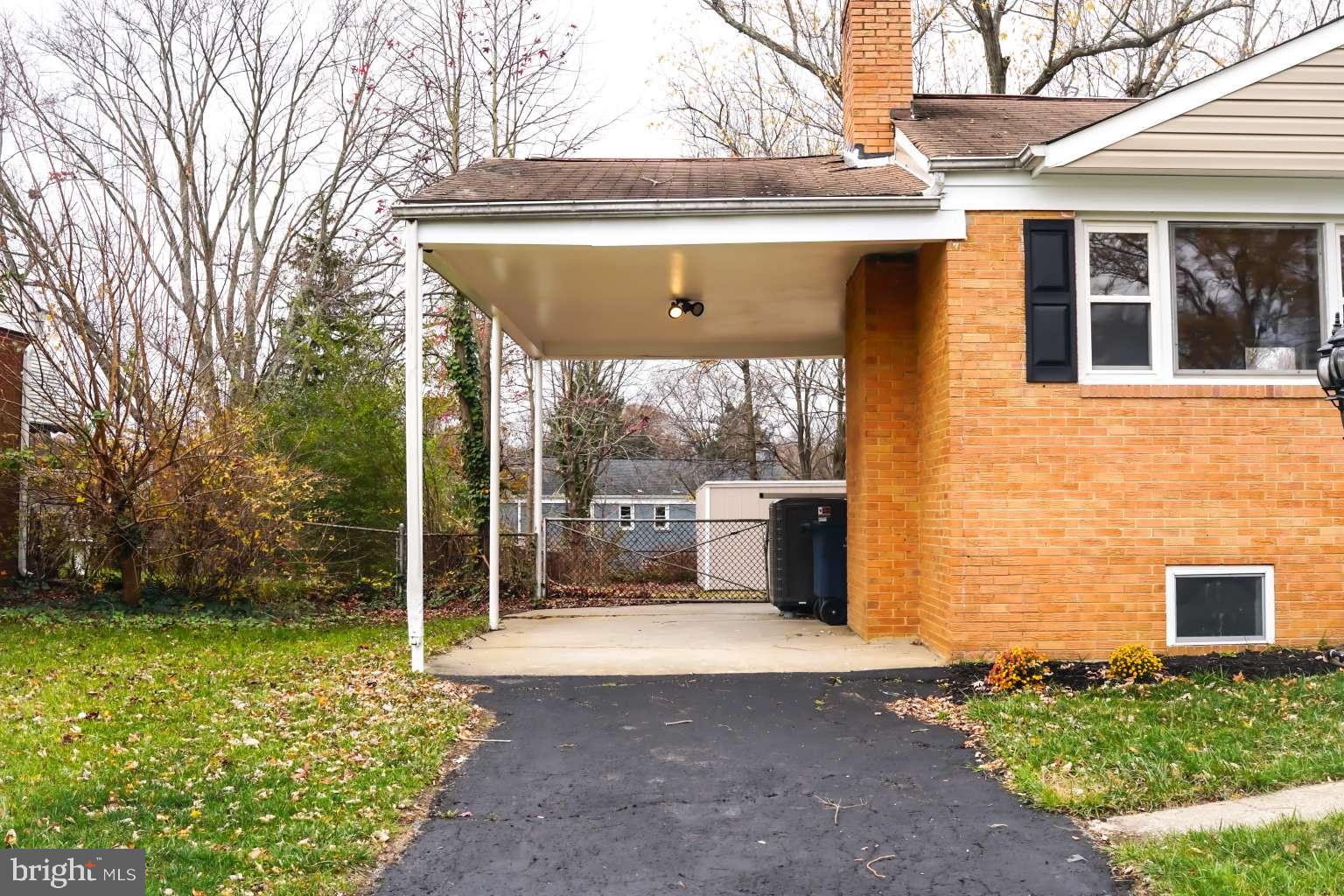 7107 Loch Raven Road Temple Hills, MD 20748 - Photo 3 of 36 a view of a house with a yard and potted plants
