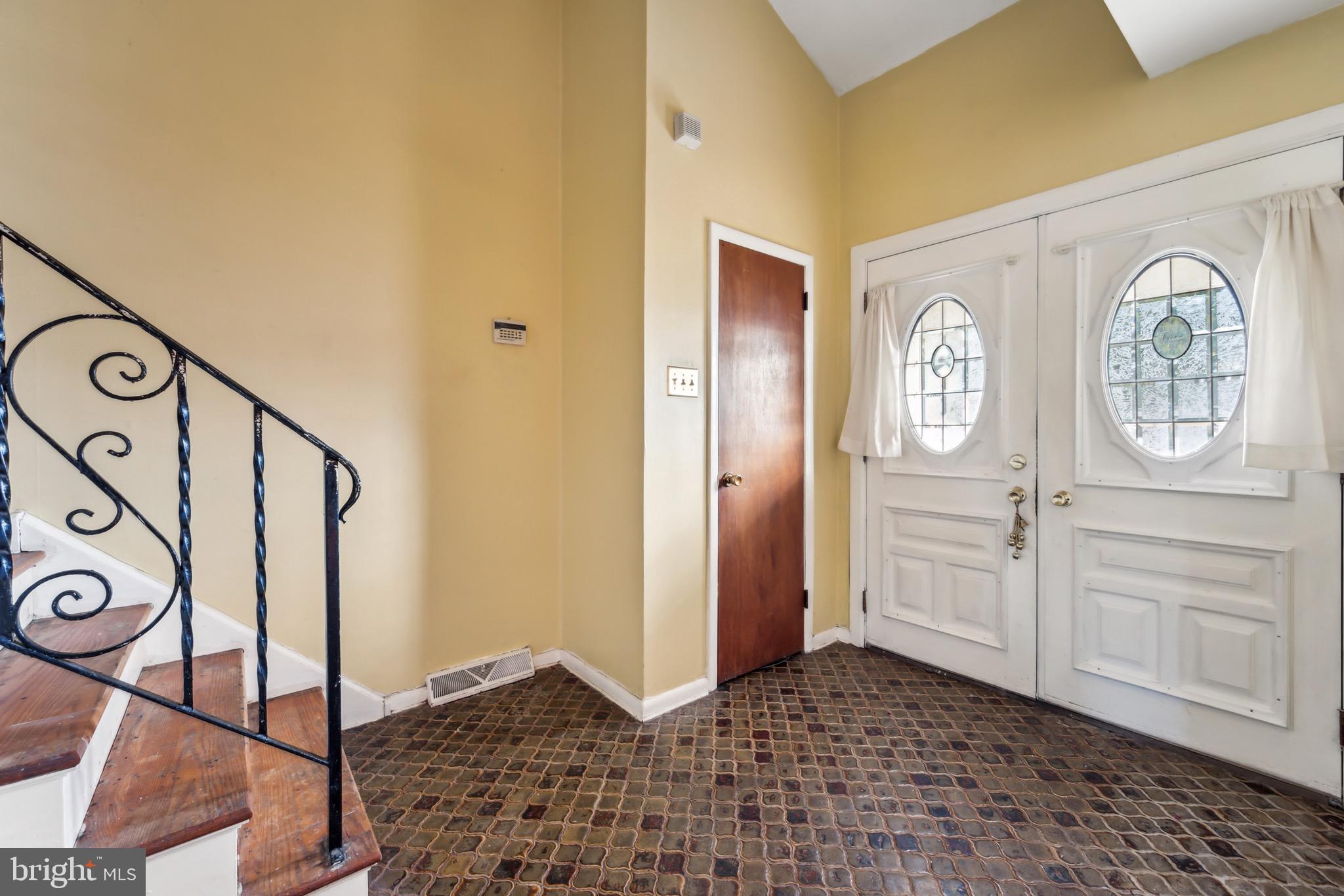 116 Colonial Road Beverly, NJ 08010 - Photo 3 of 25 a view of an entryway with wooden floor