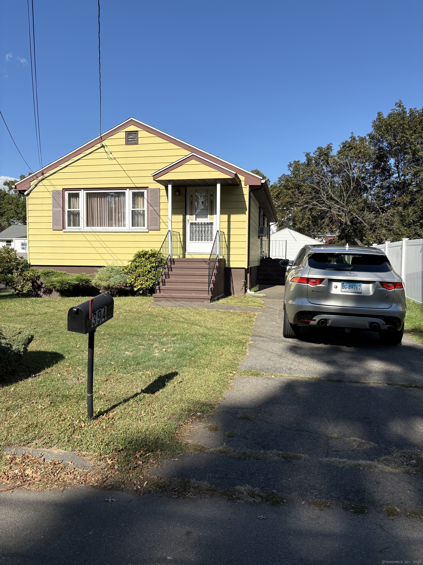 394 Harding Avenue Stratford, CT 06615 - Photo 2 of 11 a front view of a house with a yard