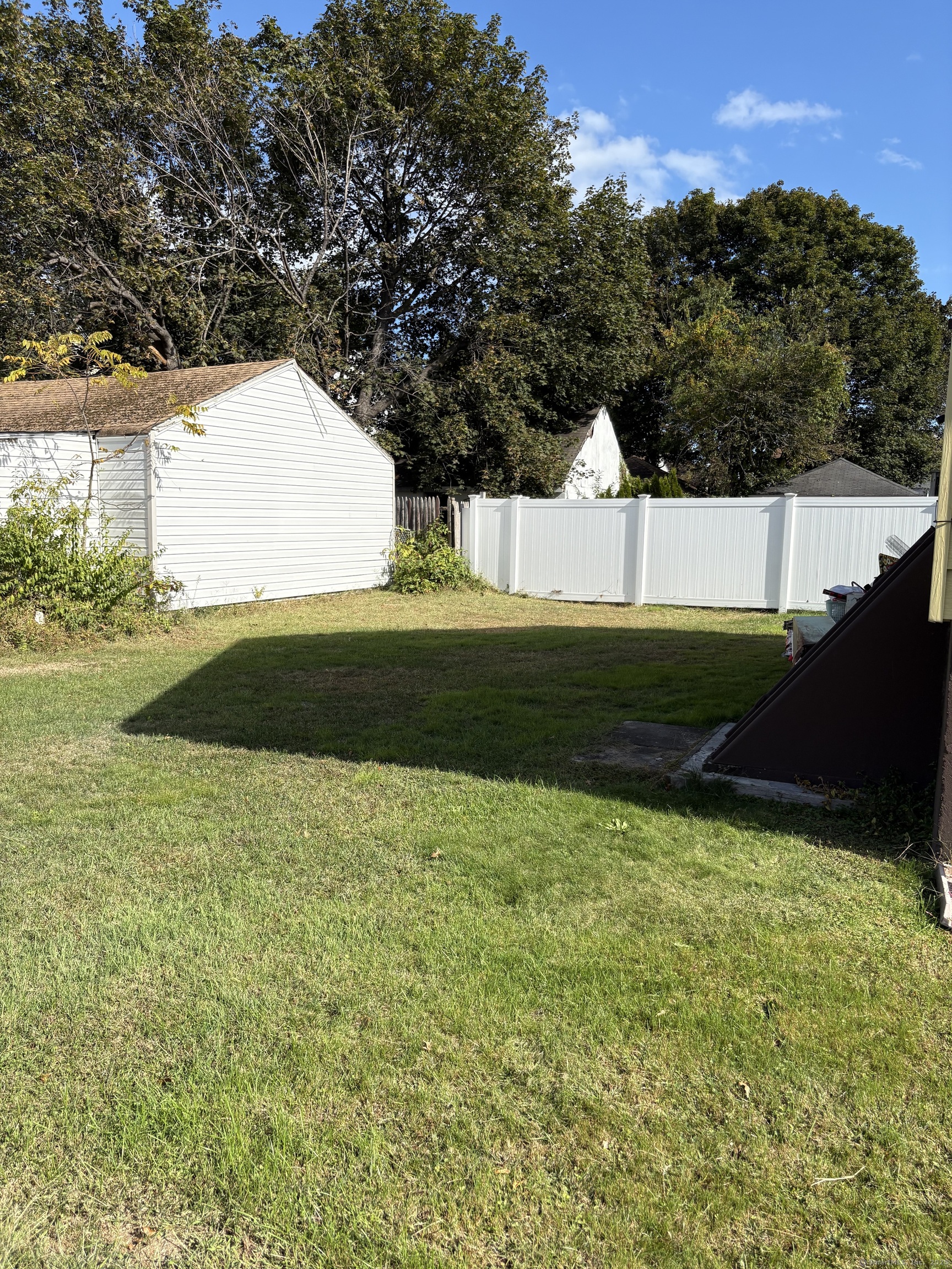 394 Harding Avenue Stratford, CT 06615 - Photo 3 of 11 a view of yard with swimming pool and green space