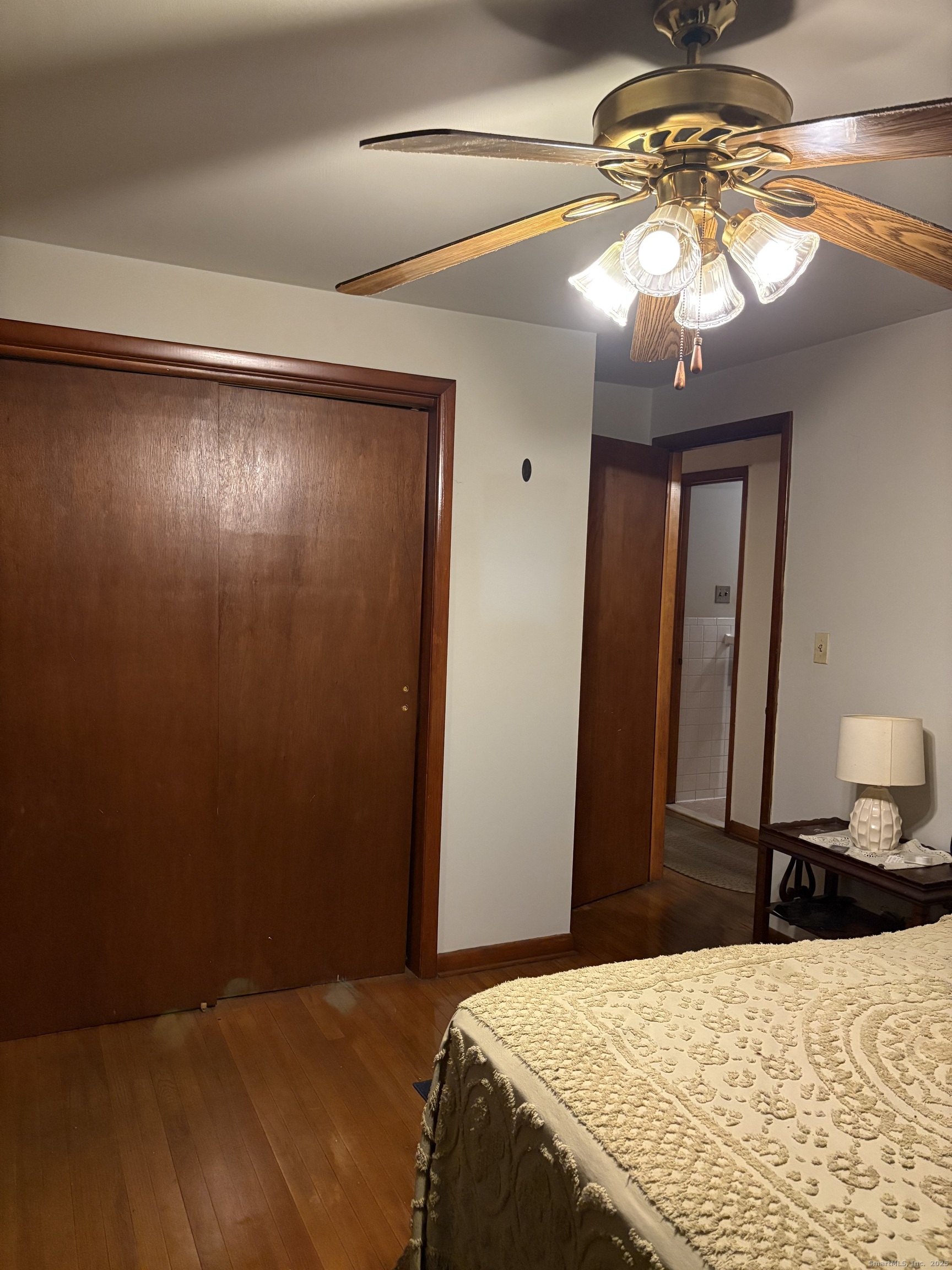 394 Harding Avenue Stratford, CT 06615 - Photo 8 of 11 a bedroom with a bed and a mirror