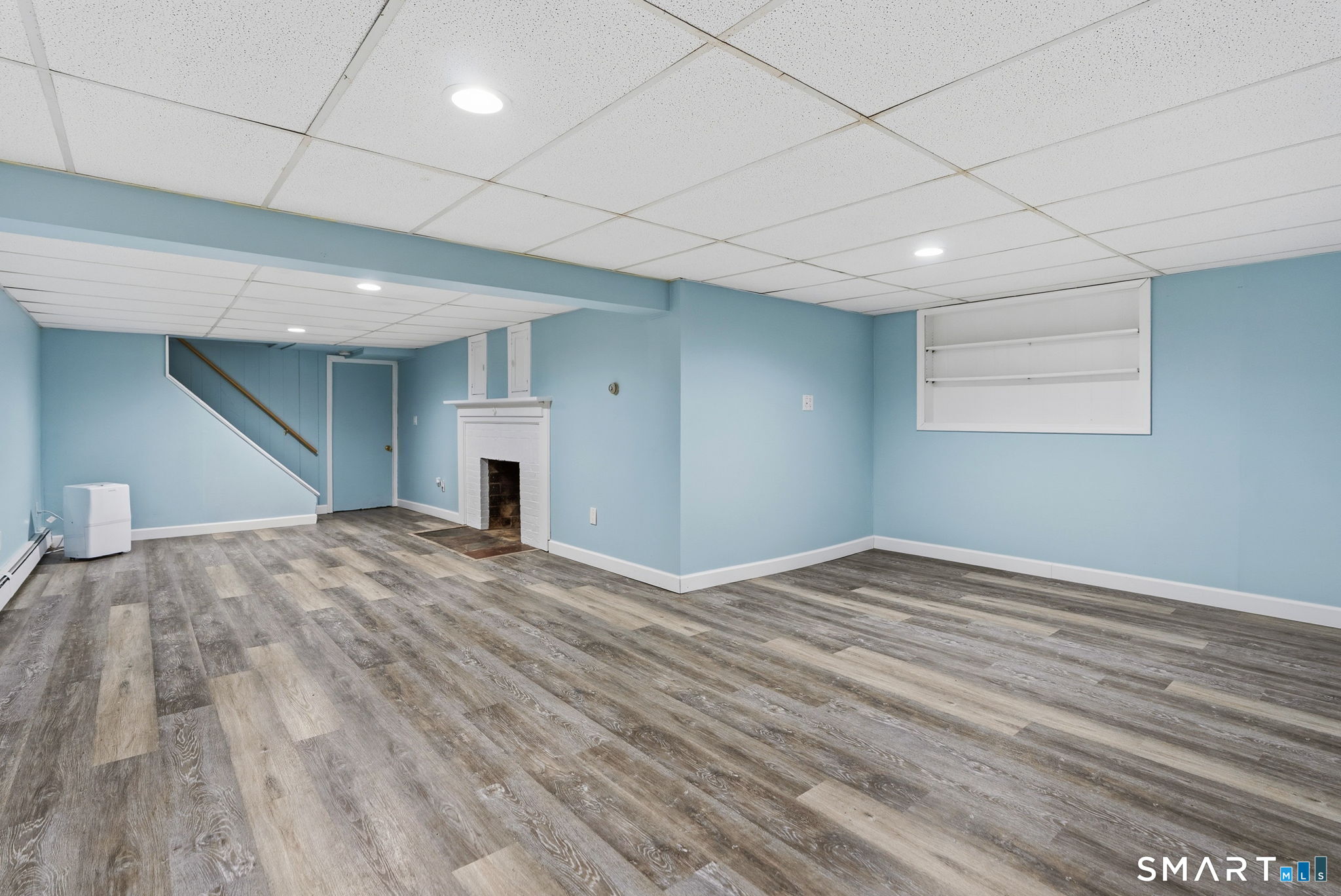 59 Thornbush Road Wethersfield, CT 06109 - Photo 18 of 33 luxury vinyl flooring, wood burning fireplace