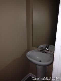 11910 Bending Branch Road Charlotte, NC 28227 - Photo 14 of 16 a bathroom with a sink and mirror