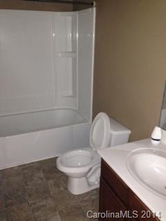 11910 Bending Branch Road Charlotte, NC 28227 - Photo 16 of 16 a white toilet sitting next to a bathroom sink