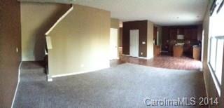 11910 Bending Branch Road Charlotte, NC 28227 - Photo 5 of 16 a view of a hallway with wooden floor
