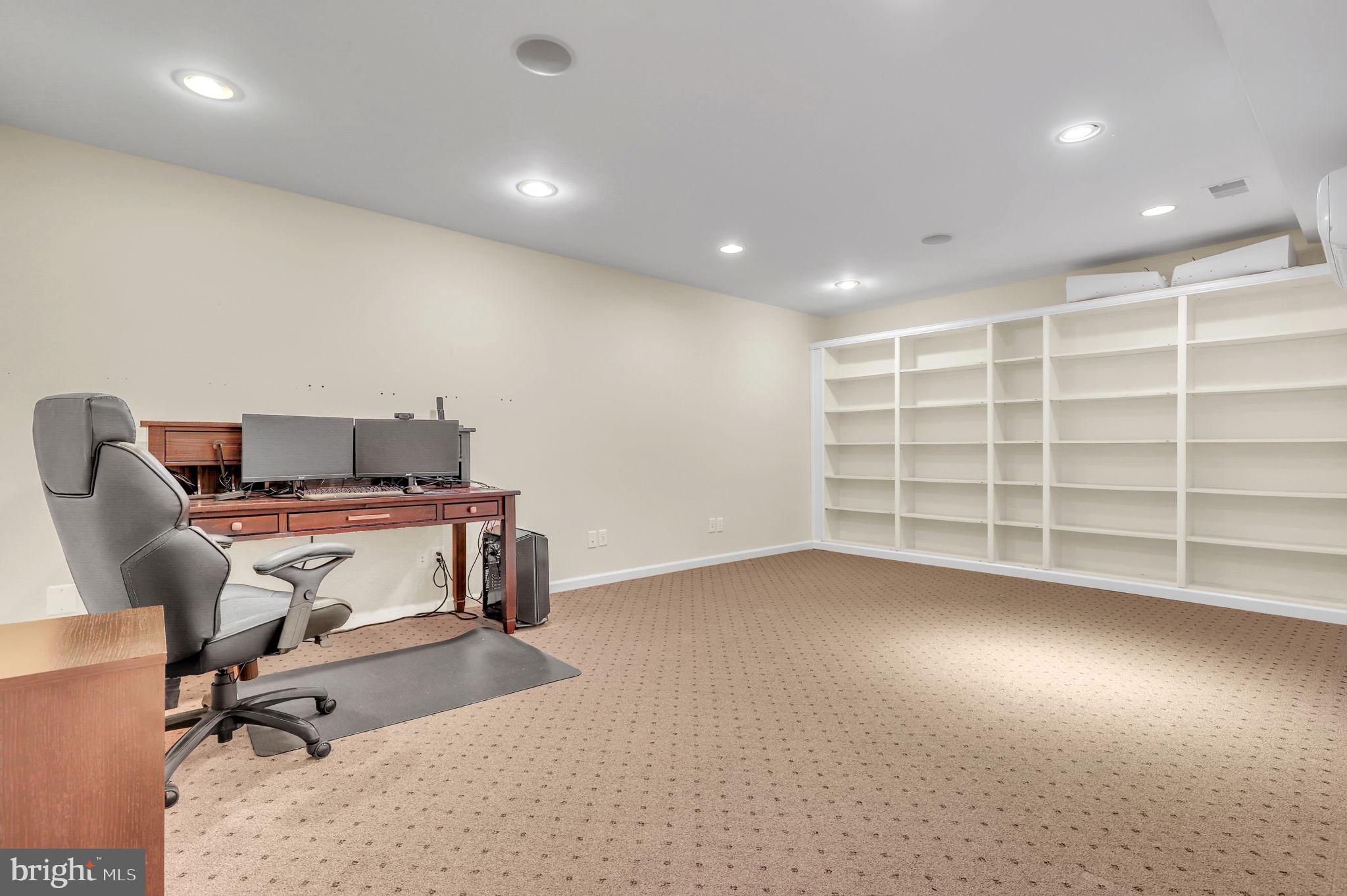 11846 Simpson Road Clarksville, MD 21029 - Photo 32 of 72 Basement study room with built in shelving