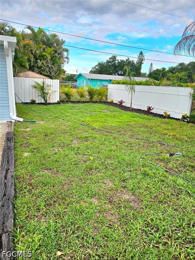 1130 Patterson Road Cape Coral, FL 33909 - Photo 13 of 21 a view of yard with swimming pool