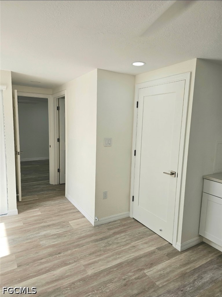 1130 Patterson Road Cape Coral, FL 33909 - Photo 17 of 21 a view of a hallway with wooden floor