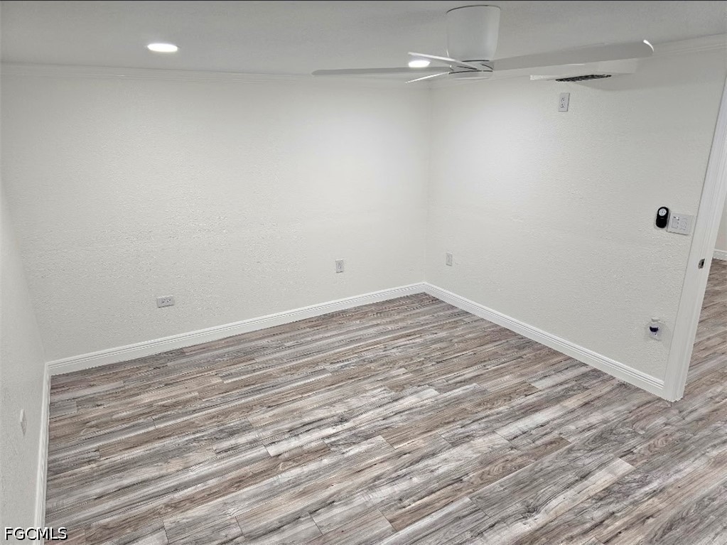 1130 Patterson Road Cape Coral, FL 33909 - Photo 8 of 21 a view of a room with wooden floor