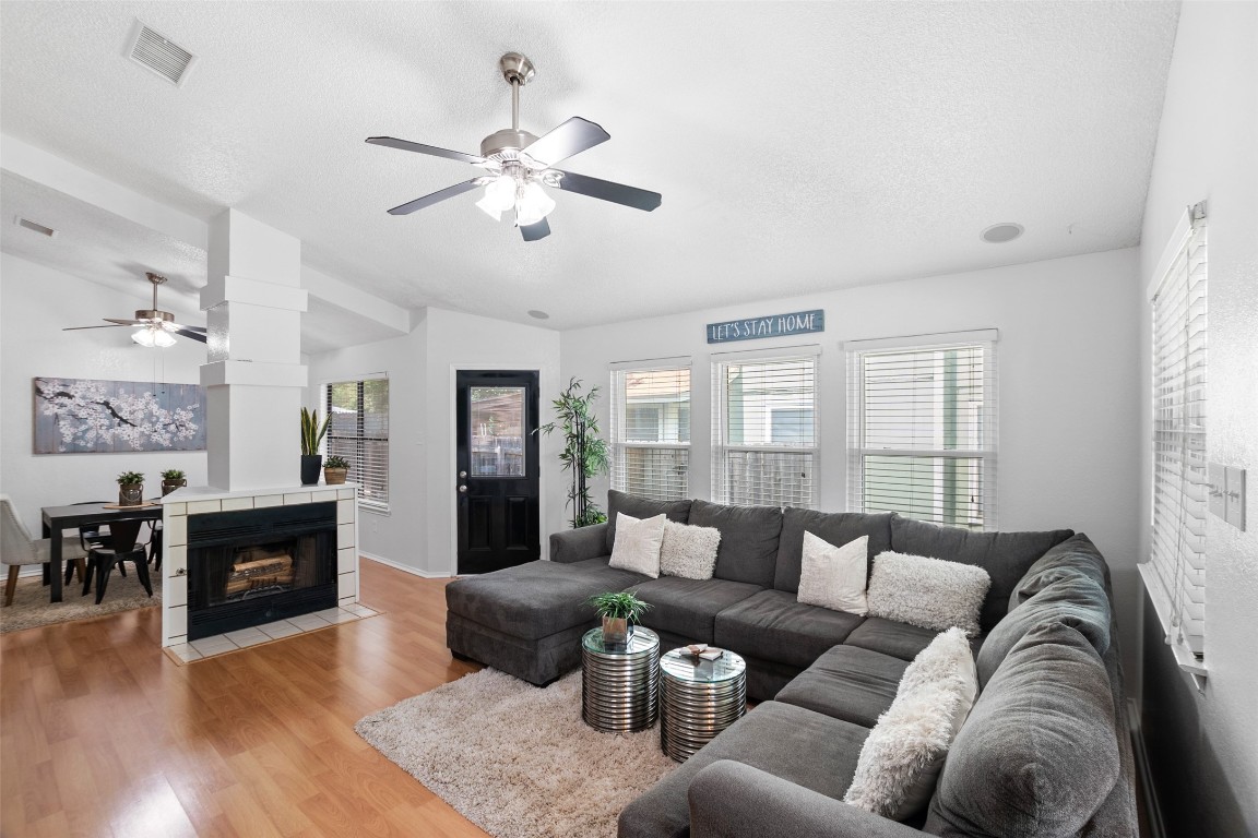 10418 Bilbrook Place Austin, TX 78748 - Photo 1 of 1 a living room with furniture and wooden floor
