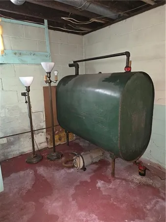 a room with a washing machine and a mirror