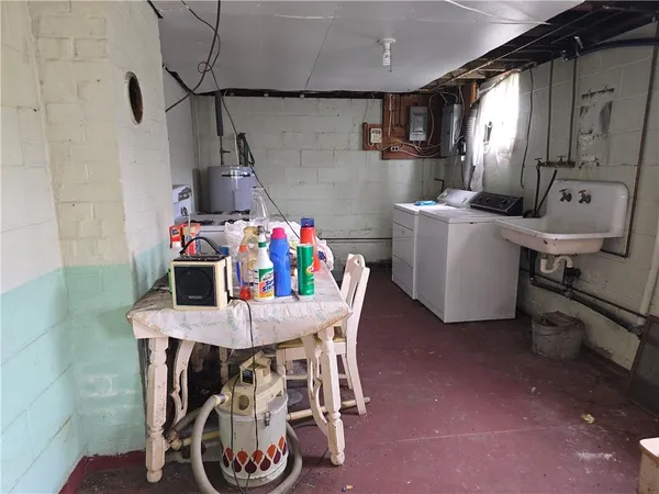 a view of a dining room with furniture and a chandelier