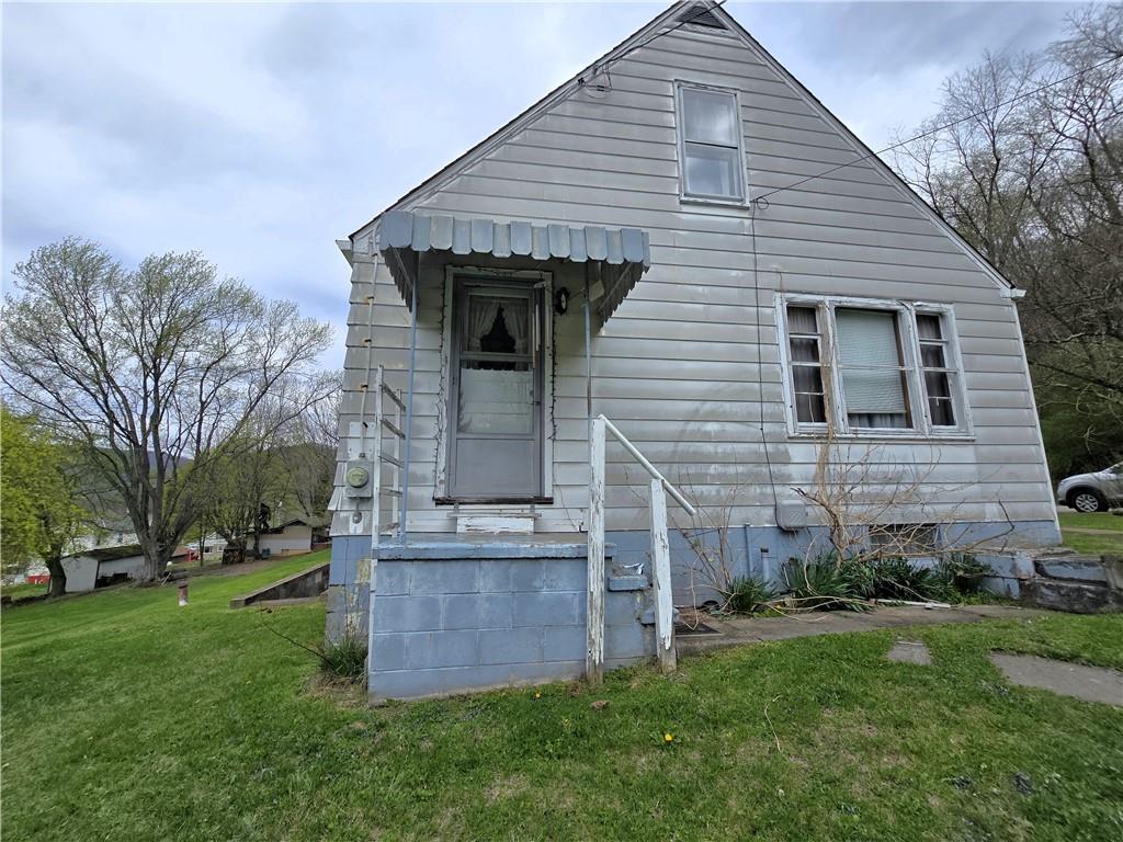 908 Walnut Street Bolivar, PA 15923 - Photo 3 of 25 a view of a house with a yard