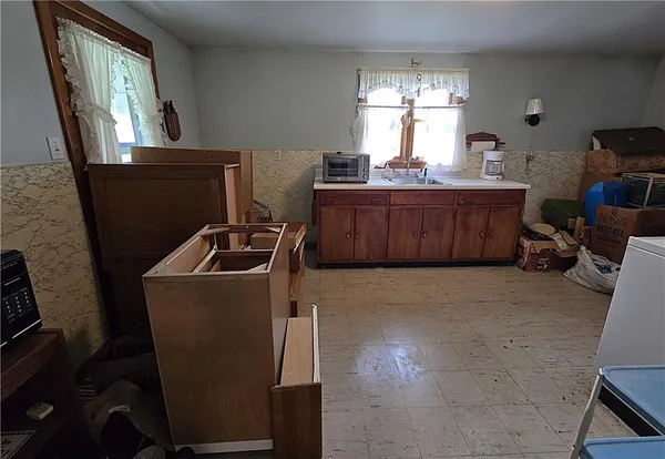 a room with granite countertop furniture a window and a couch